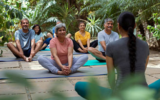 Caregivers supporting senior people in an elderly care setting